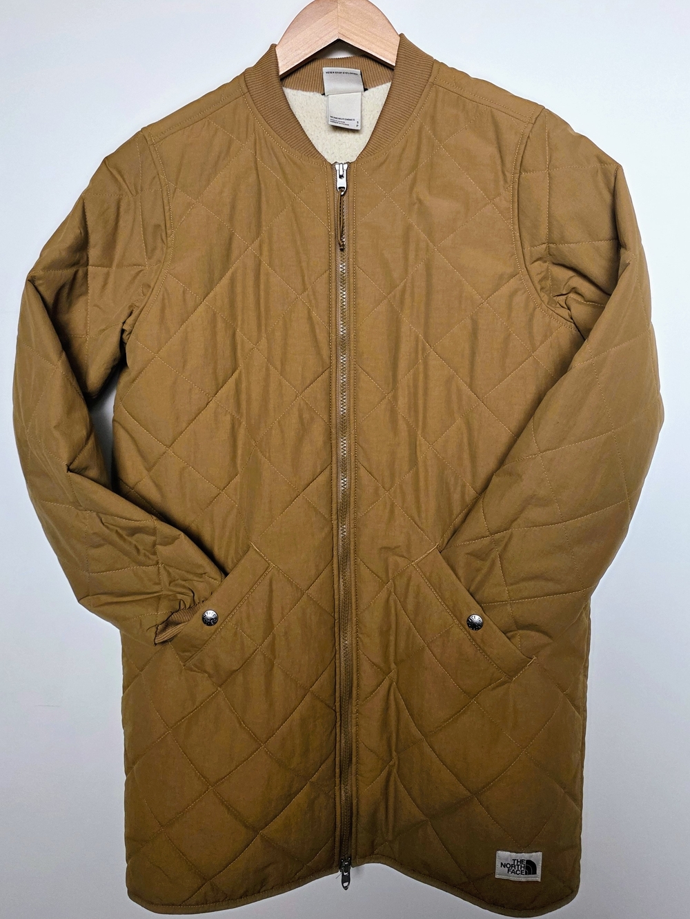 The North Face Quilted Long Puffer Jacket in Brown